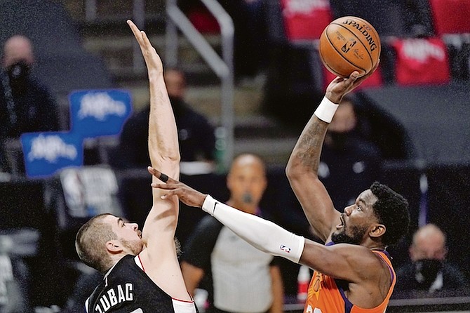 Phoenix Suns centre Deandre Ayton, right, shoots as Los Angeles Clippers centre Ivica Zubac defends during the first half in Game 3 of the NBA Western Conference Finals last night in Los Angeles. The Clippers cut their series deficit to 2-1, ending the Suns’ franchise-record playoff winning streak at nine games.

(AP Photo/Mark J Terrill)