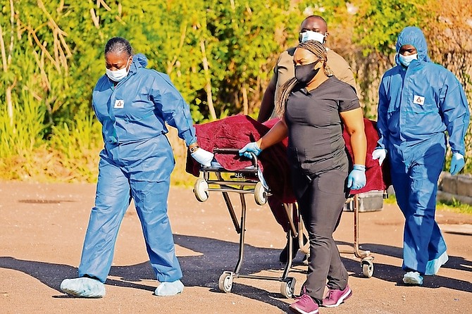 The body is removed from the scene. Photo: Donavan McIntosh