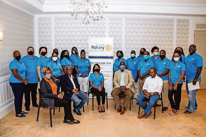 PRESIDENT of Rotary Club South Ocean Zelma Wilson, a director at EY Bahamas Limited (seated
centre), with club members.