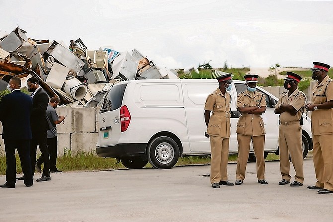 Police at the landfill yesterday where a body was found. 
Photo: Donovan McIntosh/Tribune Staff