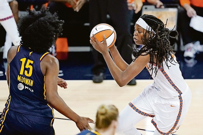 Sun’s Jonquel Jones (35) goes to the basket against Fever’s Teaira McCowan (15) during the first half on Saturday in Indianapolis.

(AP Photo/Darron Cummings)