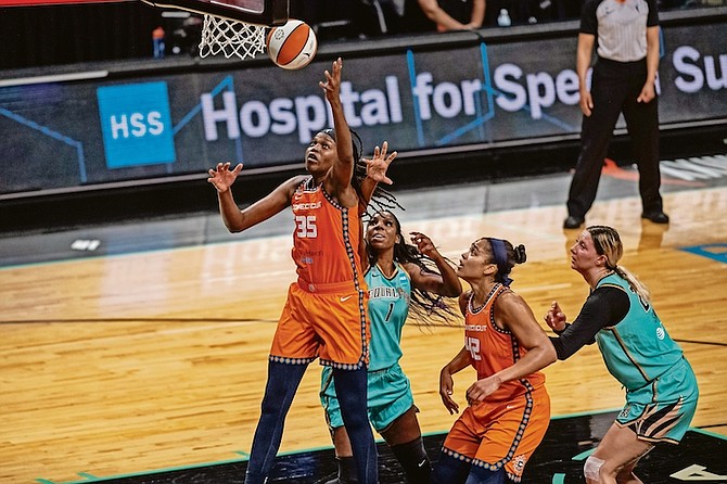 Connecticut Sun’s Jonquel Jones (35) attempts to steal the ball during the first half against the New York Liberty on Sunday in New York.

(AP Photo/Brittainy Newman)