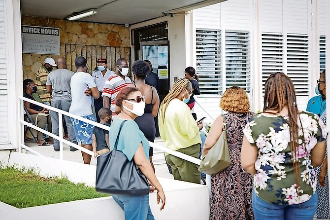 Lengthy lines at the Parliamentary Registration Department yesterday as speculation builds about the prospects of an early election call by Prime Minister Dr Hubert Minnis. Photo: Racardo Thomas/Tribune Staff