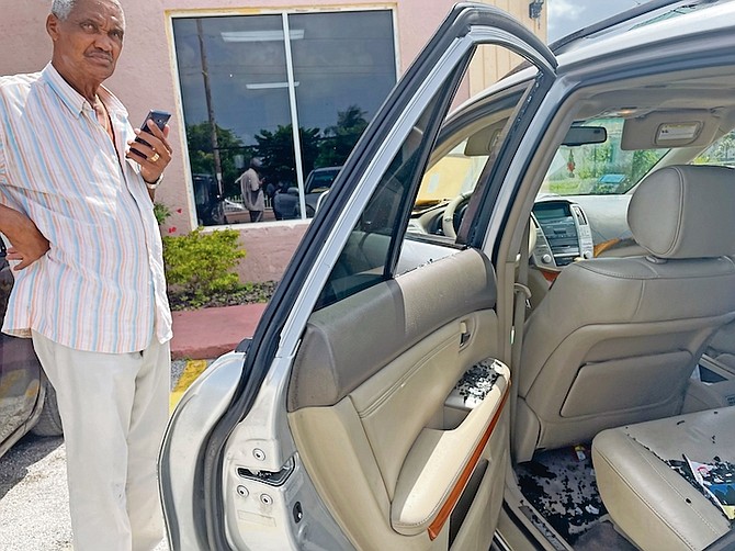 Former MP Leslie Miller with his vehicle after he said $2,700 - his employees’ payroll - was stolen after it was left in his parked car as he went shopping.