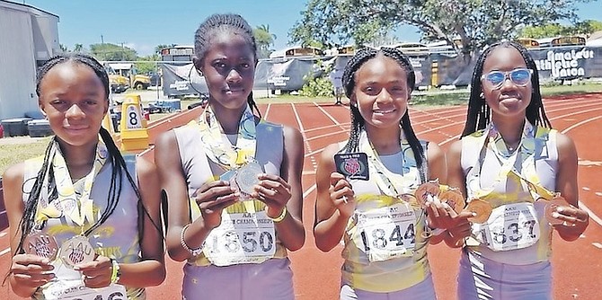 ROADRUNNERS dynamic quartet of Caitlyn Smith, Jasmine Thompson, J’Kaiyah Rolle and Tamia Edwards pose with their medals.