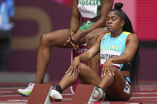 Tynia Gaither waits to start in her heat of the women's 100-metres at the 2020 Summer Olympics, Friday, July 30, 2021, in Tokyo. (AP Photo/Matthias Schrader)