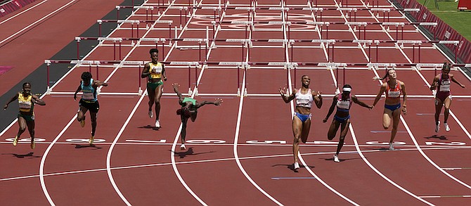 Devynne Charlton (second from left) in the 100m hurdles final. (AP Photo/Charlie Riedel)