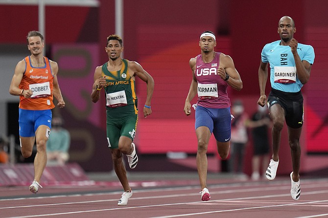 Steven Gardiner (right) competes in the semifinal of the men's 400-metres. (AP Photo/Petr David Josek)