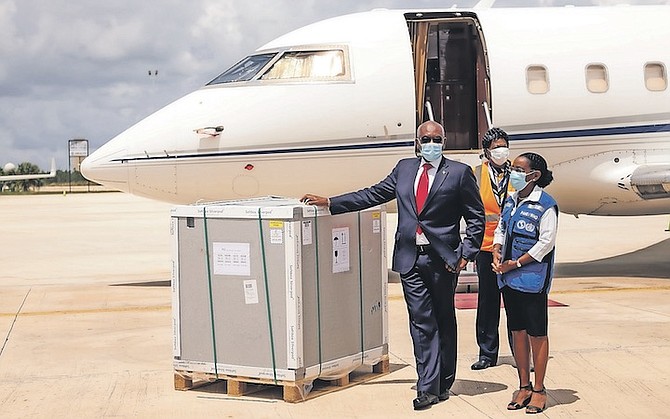 PRIME Minister Hubert Minnis welcomes the third tranche of 33,600 AstraZeneca Covid-19 vaccines via the Covax facility.
Photo: Donovan McIntosh/Tribune Staff