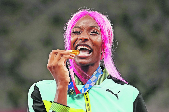 Shaunae Miller-Uibo with her gold medal. (AP Photo/Martin Meissner)