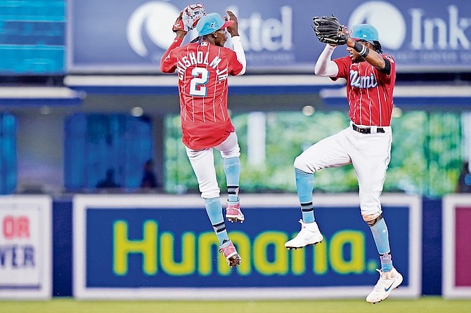 Miami Marlins second baseman Jazz Chisholm Jr (2) and left fielder Lewis Brinson celebrate after a baseball game against the Chicago Cubs on Sunday in Miami.

(AP Photo/Lynne Sladky)