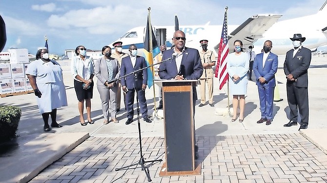PRIME Minister Dr Hubert Minnis welcoming the arrival of the shipment of Pfizer vaccine doses Thursday morning at Jet Nassau, alongside US Embassy Charge d’Affaires Usha Pitts and officials.
PHOTO: Patrick Hanna/BIS