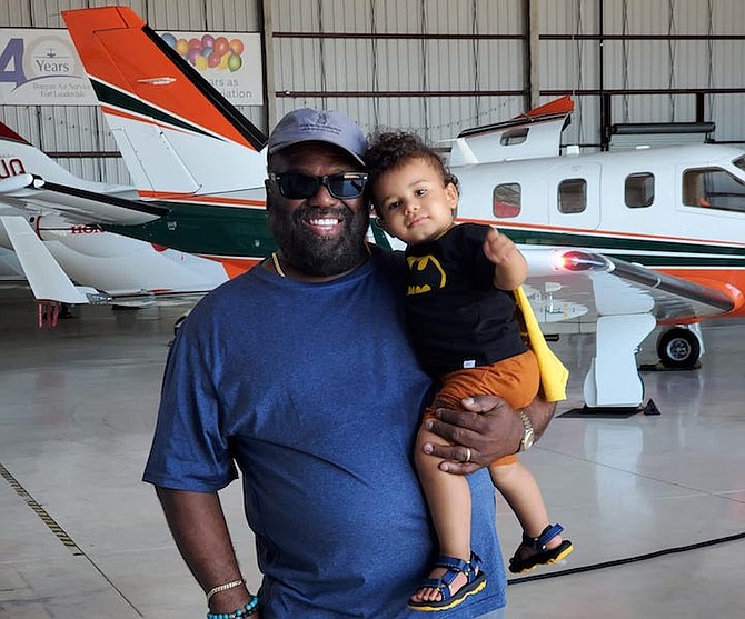 Andy, CEO of Bahamas Global Clearance, with his grandson at Bahamas Preclearance facility in the Fort Lauderdale Executive Airport.