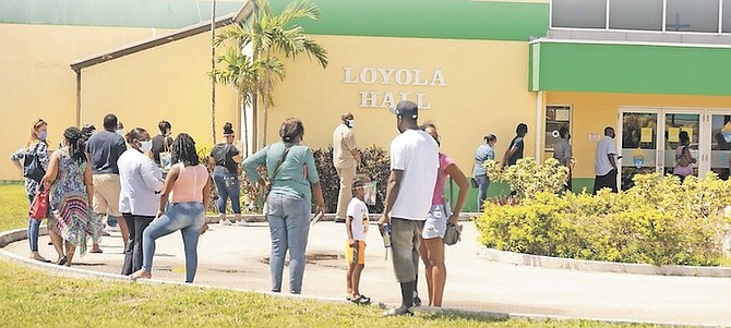 RESIDENTS queuing at the Loyola Hall vaccination site.