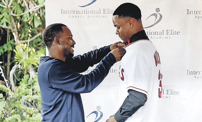 KRISTIN MUNROE, right, shares a special moment with Geron Sands, during his international signing with the LA Angels baseball team.