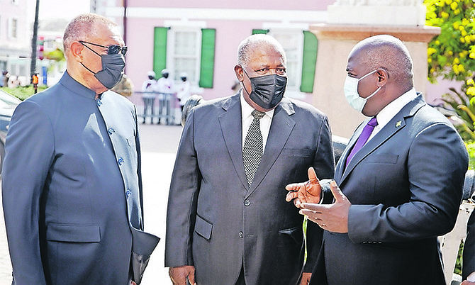 From left, former Prime Ministers Perry Christie and Hubert Ingraham talking to PLP leader Philip “Brave” Davis yesterday.
