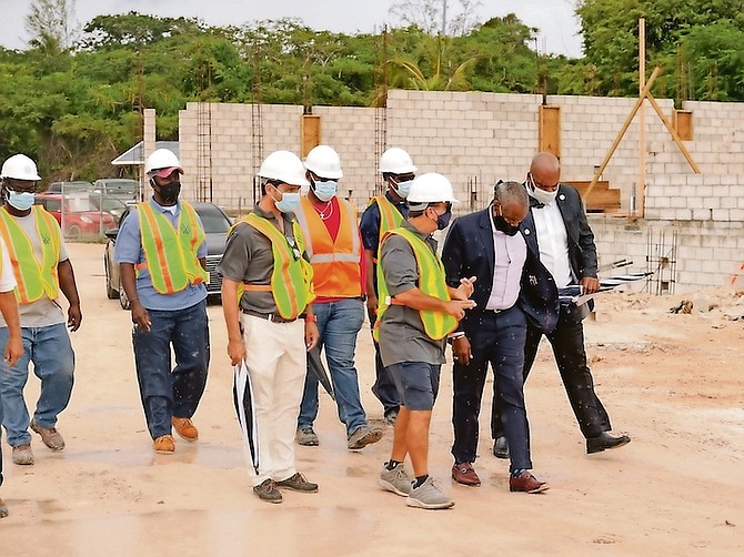COSTA Berdanis tours the Westend residential project with Deputy Prime Minister Desmond Bannister
yesterday. Photo: Donovan McIntosh/Tribune Staff