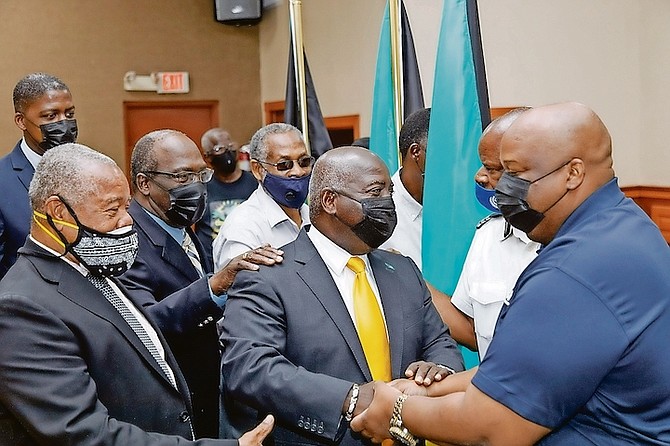 PLP leader Philip “Brave” Davis with union leaders on Wednesday in this image provided by the PLP.