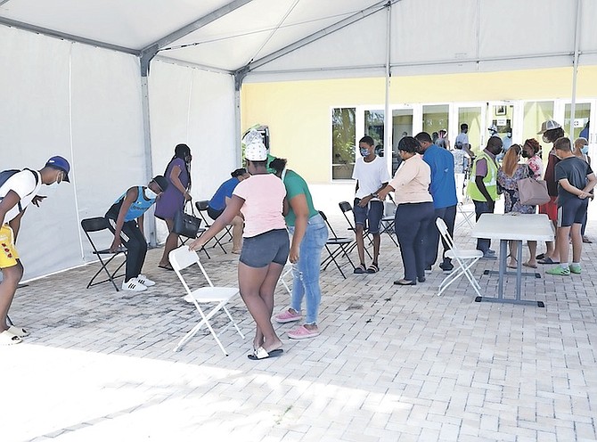 PEOPLE line up for the Pfizer vaccine at Kendal Issacs Gym earlier this month. Photo: Racardo Thomas/Tribune Staff