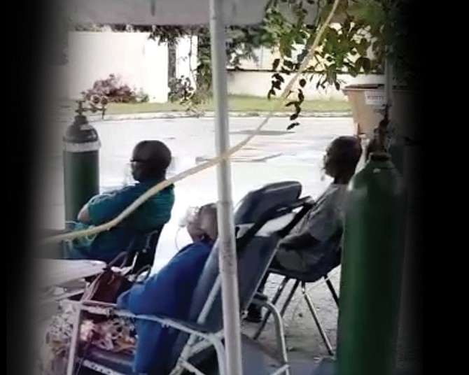 In this image from video, patients are seen apparently receiving oxygen in an outdoor tent at South Beach Clinic.