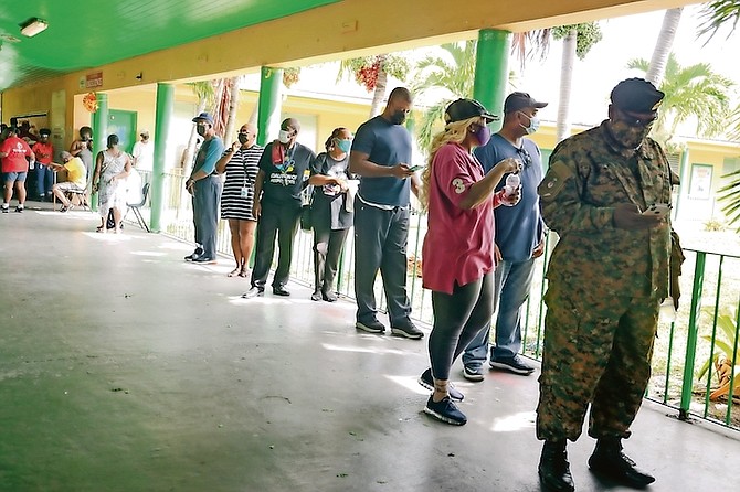 Voters line up at Sadie Curtis Primary School. Photo: Donavan McIntosh/Tribune staff