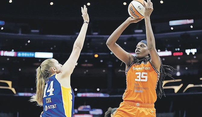 CONNECTICUT Sun forward Jonquel Jones shoots over Los Angeles Sparks forward Lauren Cox during the first half of the WNBA basketball game on Thursday in Los Angeles. Photo: Ashley Landis/AP