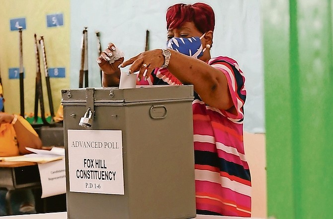 A voter placing her ballot at the CI Gibson Senior High School Polling Station in the advanced poll.
Photo: Donovan McIntosh/Tribune Staff