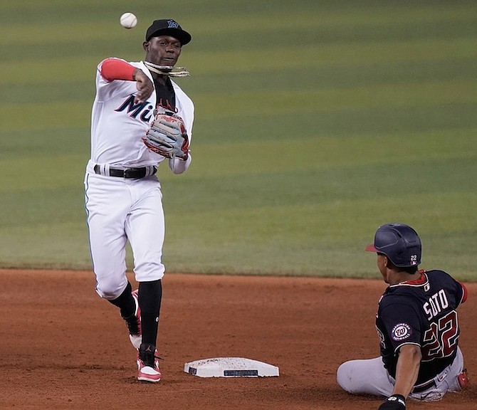 WASHINGTON Nationals’ Juan Soto (22) is out on second base as Miami Marlins second baseman
Jasrado “Jazz” Chisholm Jr throws to first to complete the double play during the fifth inning of a
baseball game yesterday in Miami.
(AP Photo/Marta Lavandier)