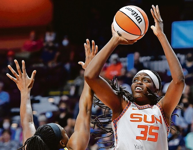 CONNECTICUT Sun forward Jonquel Jones (35) shoots over Los Angeles Sparks forward Nneka Ogwumike (30) during a WNBA basketball game in Uncasville, Conn., on Saturday, August 28, 2021. This year, the 6-foot-6 Jones is the unanimous choice for AP Player of the Year honours by the 14-member panel, announced yesterday. 
(Sean D Elliot/The Day via AP, File)