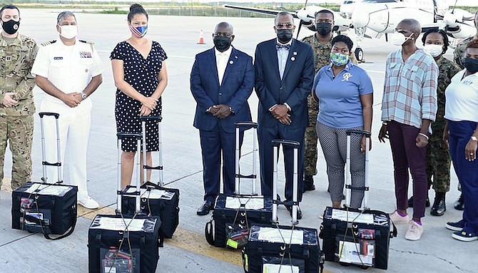 PRIME Minister Philip “Brave” Davis, Foreign Affairs and Public Service Minister Fred Mitchell and US Chargé d’Affaires Usha Pitts sending off vaccinations to the Family Islands yesterday. Photo: Donovan McIntosh/Tribune Staff