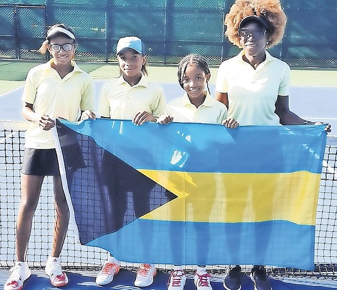 COACH MARION BAIN, far right, is more than pleased with what she has seen so far from the BLTA’s three-member team at the International Tennis Federation’s COTECC Under-12 competition in Santo Domingo. Shown left to right are Tatyana Madu, Kaylah Fox and Brianna Houlgrave.