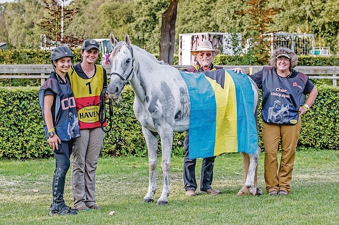 MAKING OUR ISLAND NATION PROUD: Reine Pagliaro, far left, Beau (horse) and Team Bahamas members at the FEI World Endurance Championship for Young Riders & Juniors in Ermelo, Netherlands.