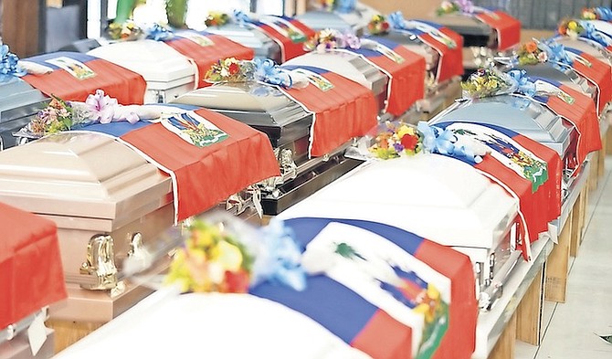 COFFINS at a funeral service in 2019 for 22 Haitian nationals who lost their lives at sea.