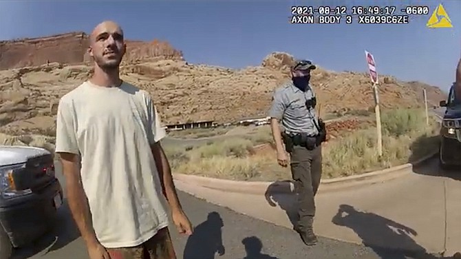 This Aug. 12, 2021 file photo from video provided by The Moab Police Department shows Brian Laundrie talking to a police officer after police pulled over the van he was traveling in with his girlfriend, Gabrielle "Gabby" Petito, near the entrance to Arches National Park. (The Moab Police Department via AP, File)