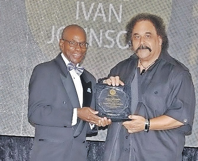 IVAN Johnson receiving his Pioneer award from Press Club president Anthony Capron in 2018. Photo: Press Club