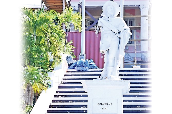 The Columbus statue at Government House with an arm and a leg missing after being attacked with a sledgehammer on Saturday. Photo: Racardo Thomas/Tribune Staff