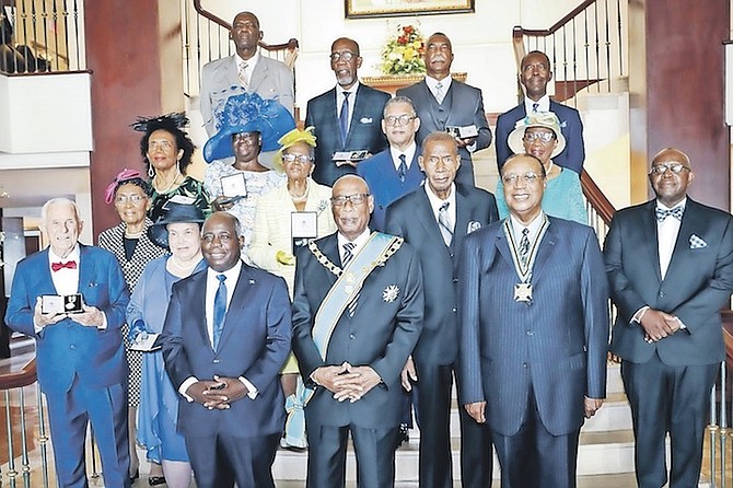 SIXTEEN Bahamians were honoured on National Heroes Day yesterday. Receiving their honours from Governor General CA Smith at the ceremony are Order of The Bahamas recipient Algernon Allen, Order of Distinction recipients Leon Livingston Smith, Eugenia Cartwright, Mary Johnson, and Robert Sands, and Order of Merit recipients Percival Andrew Knowles, Patricia Glinton-Meicholas, Al Collie, Reverend Copeland Morley, Mother Vivian Cox, Celestine Eneas and Willard Rutherford. The late Dr Patricia Bazard also received the Order of Merit. Prime Minister Philip “Brave” Davis is also pictured at the event. Photo: Racardo Thomas/Tribune Staff