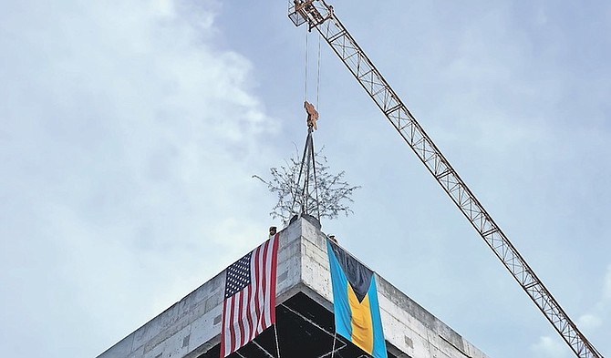 THE MOMENT when the highest point of the US Embassy was topped out on Friday.