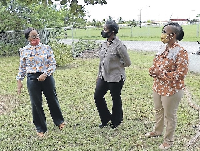PRINCIPAL Titi McKenzie Moss, right, and Olethea Gardiner, left, of the Keep Grand Bahama Clean Committee, which facilitates the Eco-School Programme on Grand Bahama, giving a tour of Beacon School.