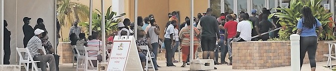 LONG lines at Kendal Issac Gymnasium as locals wait to get vaccinated yesterday.
Photo: Donovan McIntosh/Tribune Staff