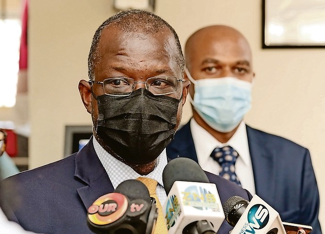 MINISTER of National Security Wayne Munroe speaking to the media after touring the parliamentary registration department.
Photo: Donovan McIntosh/Tribune Staff