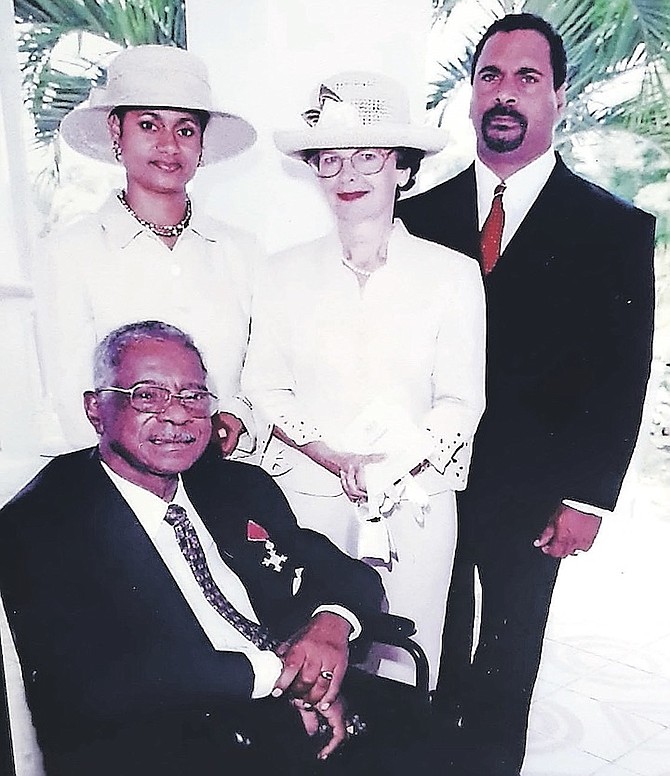 E Pedro Roberts II, seated, with his wife, Jacqueline, and children, E Pedro III and Anna Maria.