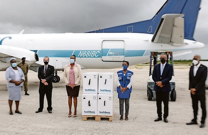 Dr Michael Darville, Dr Pearl McMillan, Dr Eldonna Boisson and other health officials welcome the delivery of 57,300 Covid-19 vaccines into the country yesterday. Photos: Donovan McIntosh/Tribune Staff