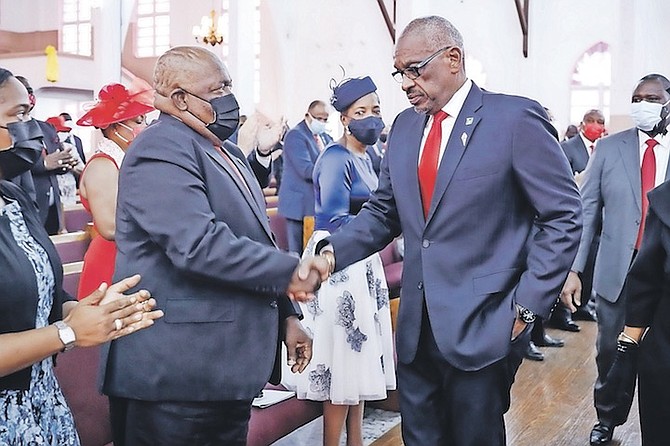 HUBERT Ingraham shakes hands with Dr Hubert Minnis at yesterday’s church service. Photo: Racardo Thomas/Tribune Staff