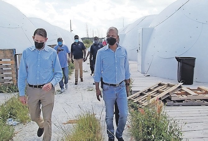 MYLES LARODA, Minister of State in the Office of the Prime Minister, inspecting the domes.