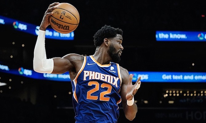 PHOENIX Suns centre Deandre Ayton grabs a rebound against the Cavaliers during the first half
on Saturday in Phoenix.
(AP Photo/Ross D Franklin)