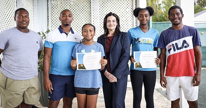 SHOWN (l-r) are coaches Philip and Kevin Major Jr, tennis player Sarae Rodgers, Audrey Oswell, player Maddison Bowleg and coach Oneil Mortimer. Photo: Racardo Thomas/Tribune Staff