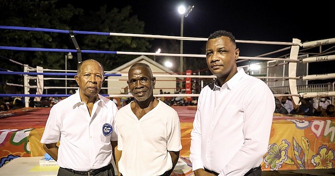 HAPPY BIRTHDAY: Shown, from left to right, are Alvin Sargent, Gregory Storr and Jermaine ‘Choo Choo’ Mackey. After devoting more than 50 years in the sport, International Boxing Association (AIBA) referee Sargent is still making his contribution to amateur boxing. Sargent, who celebrated his 71st birthday on Tuesday, was one of three officials to officiate the return of amateur boxing at the National Boxing Gymnasium on Saturday night. A large crowd of spectators showed up to watch the showdown between the host Aftershock Boxing Club and Southside Marlins Boxing Club. 
Photo: Racardo Thomas/Tribune Staff