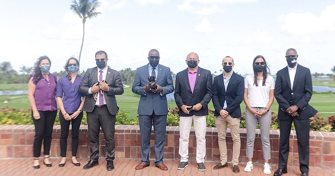 ORGANISERS of the inaugural Potcake Golf Tournament are pictured with Minister of Youth, Sports and Culture Mario Bowleg, Minister of Agriculture and Marine Resources Clay Sweeting, tournament chairman Mario Carey, and Aliv CEO John Gomez. 
Photo: Donavan McIntosh/Tribune Staff