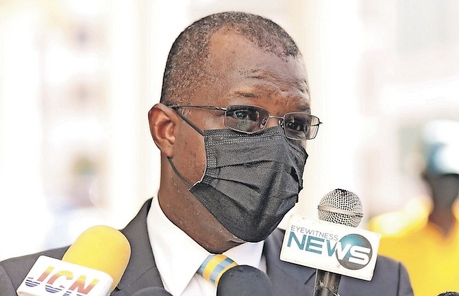 NATIONAL Security Minister Wayne Munroe, QC, speaks to the media yesterday. 
PHOTO: Donavan McIntosh/ Tribune staff